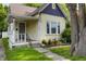 Charming single-Gathering home featuring a cozy front porch, well-maintained yard, and a blend of classic architectural details at 602 Prospect St, Indianapolis, IN 46203