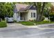 This home features a well-maintained yard, mature trees, and classic architecture with a welcoming front porch at 602 Prospect St, Indianapolis, IN 46203