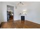 Cozy living room with hardwood floors, white trim, and a decorative fireplace mantel at 602 Prospect St, Indianapolis, IN 46203