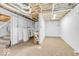 Spacious unfinished basement with concrete floor, white painted walls and ceiling, and potential for storage or customization at 6235 N Temple Ave, Indianapolis, IN 46220