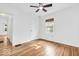 This bedroom boasts hardwood floors and a large window with natural light at 6235 N Temple Ave, Indianapolis, IN 46220