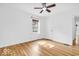 Bright, unfurnished bedroom showcasing hardwood floors and a window, ready for personalization at 6235 N Temple Ave, Indianapolis, IN 46220