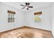 This primary bedroom boasts hardwood floors and an abundance of natural light at 6235 N Temple Ave, Indianapolis, IN 46220