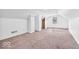 Large bonus room featuring neutral carpet, a window, and versatile open space at 6235 N Temple Ave, Indianapolis, IN 46220