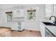 Modern kitchen features a prep island, stainless appliances, and ample cabinet space at 6235 N Temple Ave, Indianapolis, IN 46220