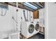 Functional laundry room with modern appliances and bright lighting at 6235 N Temple Ave, Indianapolis, IN 46220