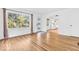 Neutral room with hardwood floors, white walls and a large window with grids at 6235 N Temple Ave, Indianapolis, IN 46220