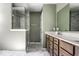 Bathroom featuring a double vanity with wood cabinets, a quartz countertop, and a frameless glass shower at 628 Tess Blvd, Westfield, IN 46074