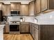 Well-equipped kitchen with stainless steel appliances, spacious countertops, and ample cabinet space at 628 Tess Blvd, Westfield, IN 46074