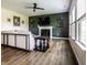 Cozy living room features a fireplace, a large window with natural light, and a ceiling fan at 628 Tess Blvd, Westfield, IN 46074
