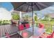 Inviting back deck with stylish outdoor furniture and a barbecue grill, perfect for entertaining at 6480 E Coal Bluff Ct, Camby, IN 46113