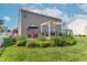 Spacious backyard with a pergola-covered deck, lush landscaping, and ample space for outdoor activities at 6480 E Coal Bluff Ct, Camby, IN 46113