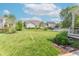 Expansive backyard featuring lush grass, mature trees, and a well-maintained landscape, perfect for outdoor activities at 6480 E Coal Bluff Ct, Camby, IN 46113