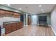 Finished basement features wood-look flooring, a wet bar, and a game area with a ping pong table at 6480 E Coal Bluff Ct, Camby, IN 46113