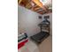 Unfinished basement area with exposed ceiling beams, a concrete wall, and treadmill for home fitness at 6480 E Coal Bluff Ct, Camby, IN 46113