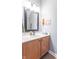 Well-lit bathroom with a stylish vanity, framed mirror, and decorative accents for a modern look at 6480 E Coal Bluff Ct, Camby, IN 46113