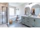 Bright bathroom featuring a standalone tub, glass shower, and dual sink vanity at 6480 E Coal Bluff Ct, Camby, IN 46113
