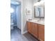 Bright bathroom featuring updated fixtures, a wood look floor and clean design at 6480 E Coal Bluff Ct, Camby, IN 46113