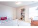 Cozy bedroom featuring a day bed, bookshelf and neutral decor and plenty of natural light at 6480 E Coal Bluff Ct, Camby, IN 46113