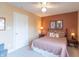 Comfortable bedroom with warm colors, decorative pillows, and ample lighting for a welcoming atmosphere at 6480 E Coal Bluff Ct, Camby, IN 46113