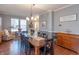 Dining room featuring an inviting atmosphere with large dining table and matching chairs at 6480 E Coal Bluff Ct, Camby, IN 46113