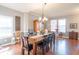Spacious dining room with hardwood floors, large windows, and comfortable seating at 6480 E Coal Bluff Ct, Camby, IN 46113