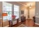 Charming foyer showcasing hardwood floors, natural light, and decorative furnishings at 6480 E Coal Bluff Ct, Camby, IN 46113