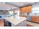 Bright kitchen with a center island, ample counter space, and stainless steel appliances at 6480 E Coal Bluff Ct, Camby, IN 46113