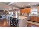 Open-concept kitchen featuring a large island, stainless steel appliances, and hardwood floors at 6480 E Coal Bluff Ct, Camby, IN 46113
