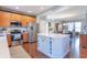 Modern kitchen with stainless steel appliances, a center island, and plenty of cabinet space at 6480 E Coal Bluff Ct, Camby, IN 46113