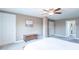 Spacious bedroom with a light-filled ensuite bath, neutral decor and a ceiling fan at 6480 E Coal Bluff Ct, Camby, IN 46113