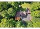 Aerial view showcasing the backyard oasis with a home, deck, and firepit at 6975 Milhouse Rd, Indianapolis, IN 46221