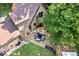 Aerial view of the backyard deck with outdoor seating, offering a great entertaining space at 6975 Milhouse Rd, Indianapolis, IN 46221
