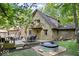 The backyard features a deck with dining and hot tub, ideal for outdoor gatherings at 6975 Milhouse Rd, Indianapolis, IN 46221