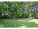 Large, flat backyard is perfect for Gathering fun and outdoor activities at 6975 Milhouse Rd, Indianapolis, IN 46221