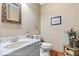 Bathroom features a stylish vanity, toilet, and tasteful decor at 6975 Milhouse Rd, Indianapolis, IN 46221