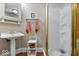 Bathroom features a sink, toilet, and glass-door shower stall at 6975 Milhouse Rd, Indianapolis, IN 46221