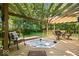 Soothing hot tub on a wooden deck, complete with a pergola and comfortable chairs, offering a private oasis at 6975 Milhouse Rd, Indianapolis, IN 46221