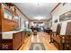 Comfortable living room with hardwood floors, and a view of the kitchen, creating an open and inviting space at 6975 Milhouse Rd, Indianapolis, IN 46221