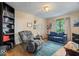 Comfortable living room features a recliner, sofa, and ample natural light at 6975 Milhouse Rd, Indianapolis, IN 46221
