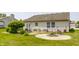 The backyard has a fire pit and a seating area for outdoor relaxation and entertainment at 7 Pondview Ct, Brownsburg, IN 46112