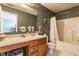 Bathroom featuring a vanity with great storage, a bathtub with shower, and neutral wall color at 7 Pondview Ct, Brownsburg, IN 46112