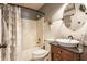 Stylish bathroom featuring a modern vanity, elegant fixtures, and a bathtub shower combination at 7 Pondview Ct, Brownsburg, IN 46112