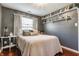 Cozy bedroom featuring a comfy bed, soft lighting, and decorative wall shelves at 7 Pondview Ct, Brownsburg, IN 46112
