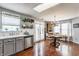Bright dining area features white cabinets, stainless steel appliances, and a view into the dining room at 7 Pondview Ct, Brownsburg, IN 46112