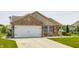 Charming brick and siding home with a two-car garage and a well-maintained front yard at 7 Pondview Ct, Brownsburg, IN 46112