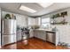 Charming kitchen featuring stainless steel appliances, modern white cabinets, and a bright, clean aesthetic at 7 Pondview Ct, Brownsburg, IN 46112