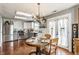 Eat in kitchen area features table and chairs, overhead lighting, stainless appliances and subway tile at 7 Pondview Ct, Brownsburg, IN 46112
