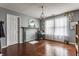 Cozy living room featuring hardwood floors, a decorative fireplace, and large windows for natural light at 7 Pondview Ct, Brownsburg, IN 46112