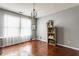 Bright room with hardwood floors, a charming chandelier, and a view to the window at 7 Pondview Ct, Brownsburg, IN 46112